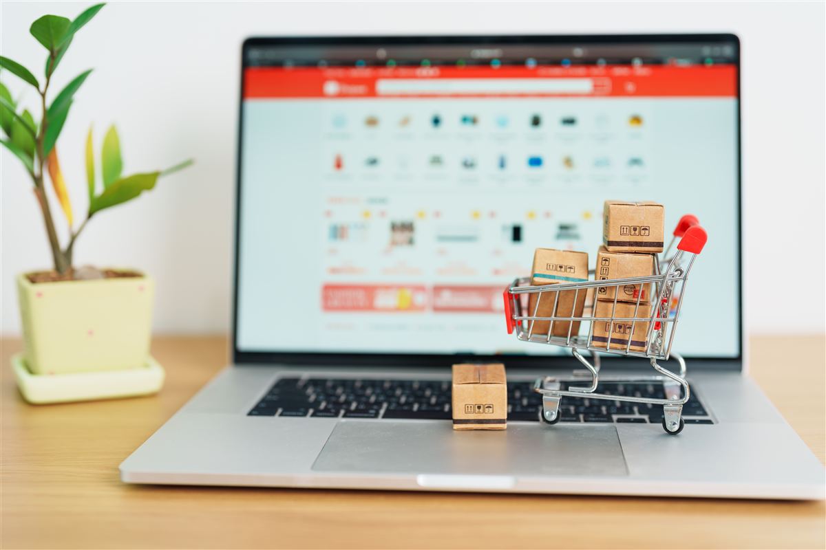 PrestoCart shopping cart and laptop on a desk